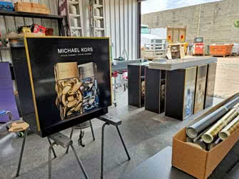 A fragrance visual merchandising display inside a workshop, ready to be delivered