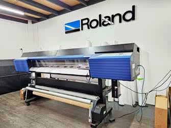 Front-right view of a Roland wide-format printer