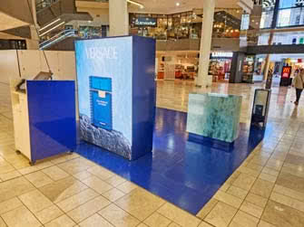 A fairly elaborate visual merchandising display for a perfume inside a shopping centre